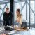 man and woman sitting at table