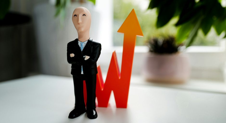 man in black suit jacket and black pants figurine